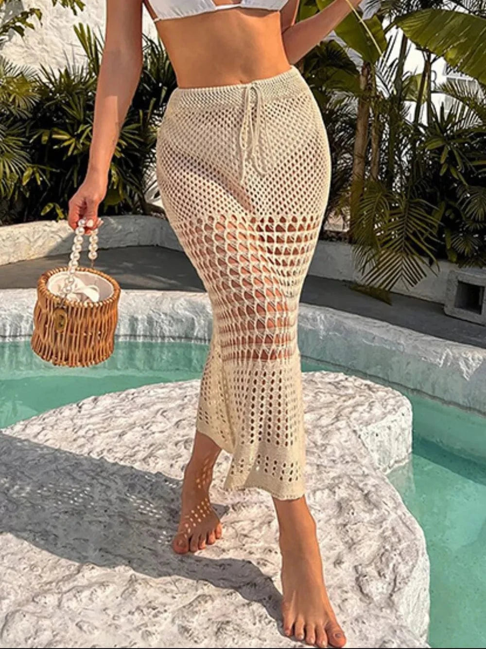 Trendsi Apparel & Accessories > Clothing > Swimwear Tan / S Tied Hollow Out Cover-Up Skirt Tied Hollow Out Cover-Up Skirt